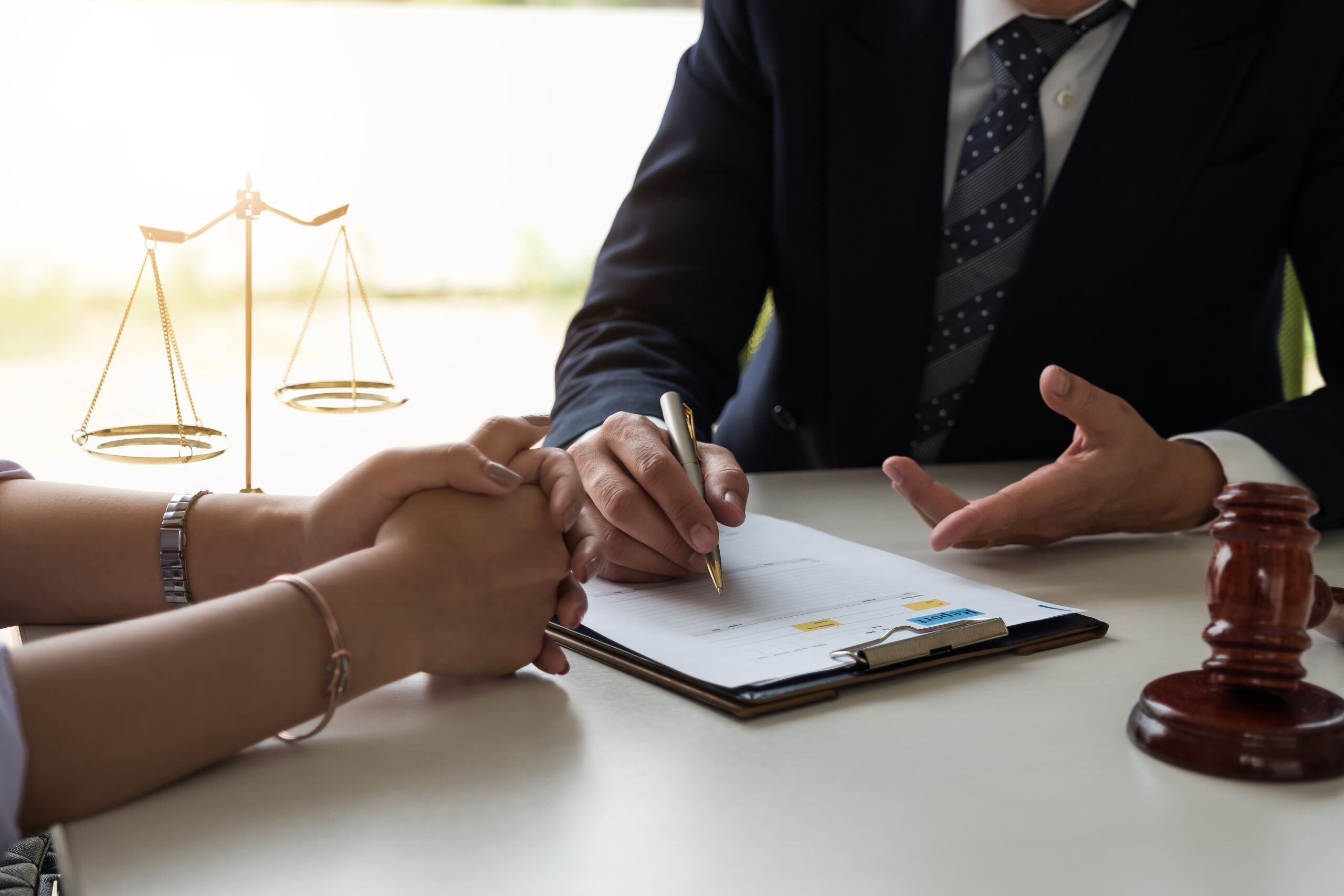 A lawyer and a client sitting at a table discussing information. If you have been convicted of a crime our fierce criminal appellate lawyer in Houston provides decades of experience to provide a strong defense for appealing your case.
