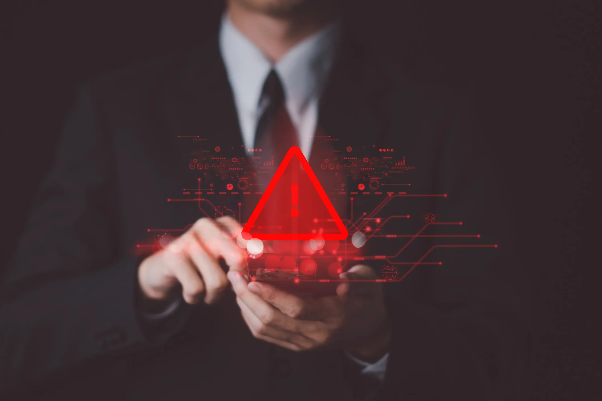 A business man with a fraud alert sign.