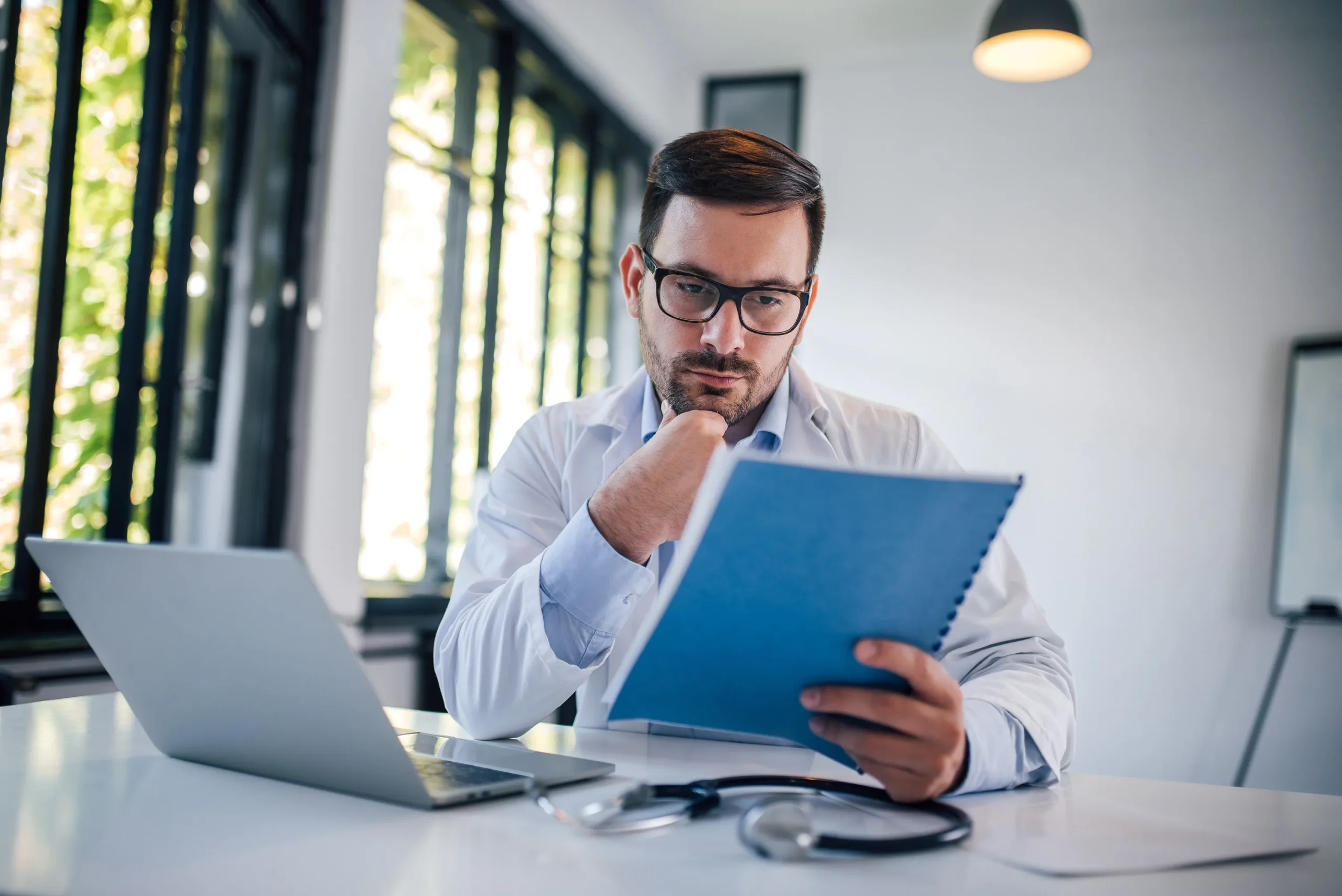 Doctor reviewing a subpoena.