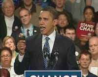 Philip Hilder Stands Behind Obama as he wins the caucus victory in Iowa